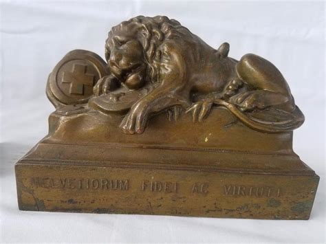 antique small metal box with helvetiorum riddle ac virtuti|Lion of Lucerne .